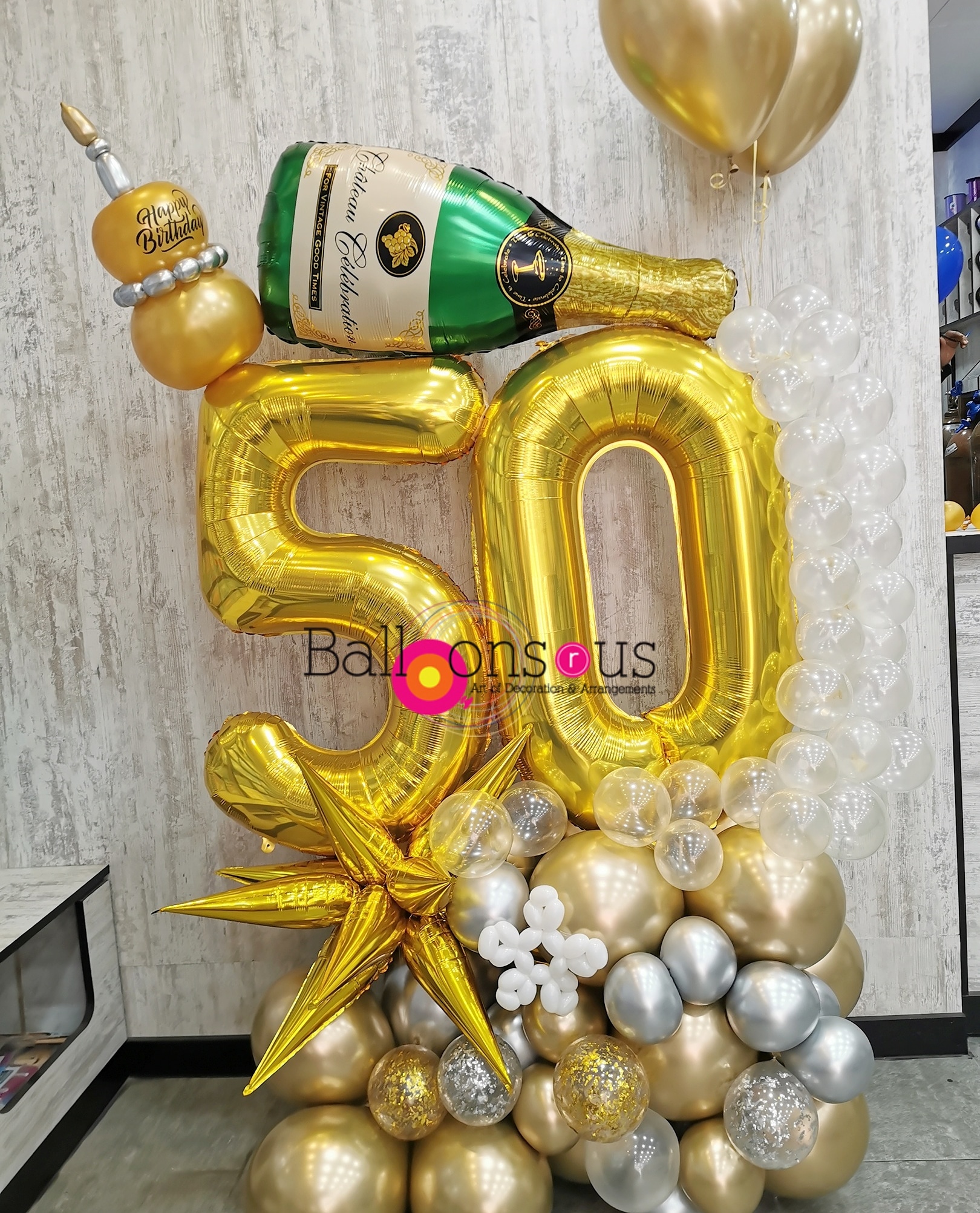 BIRHDAY ARRANGEMENT WITH CHAMPAGNE BOTTEL - BALLOONS R US AMMAN